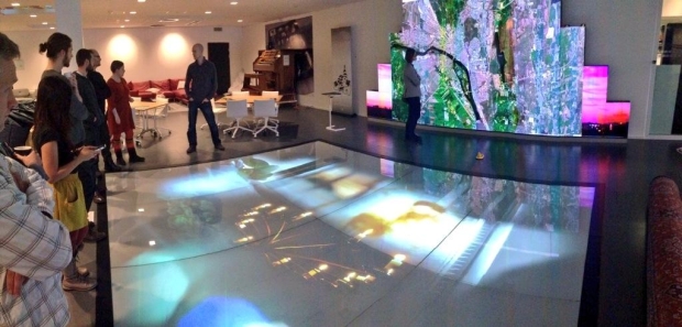 Screenscapes in HUMlab X: The floor screen and triptych screen create a magic pool (Photograph by Finn Arne Jørgensen)